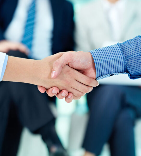 Photo of handshake of business partners after striking deal